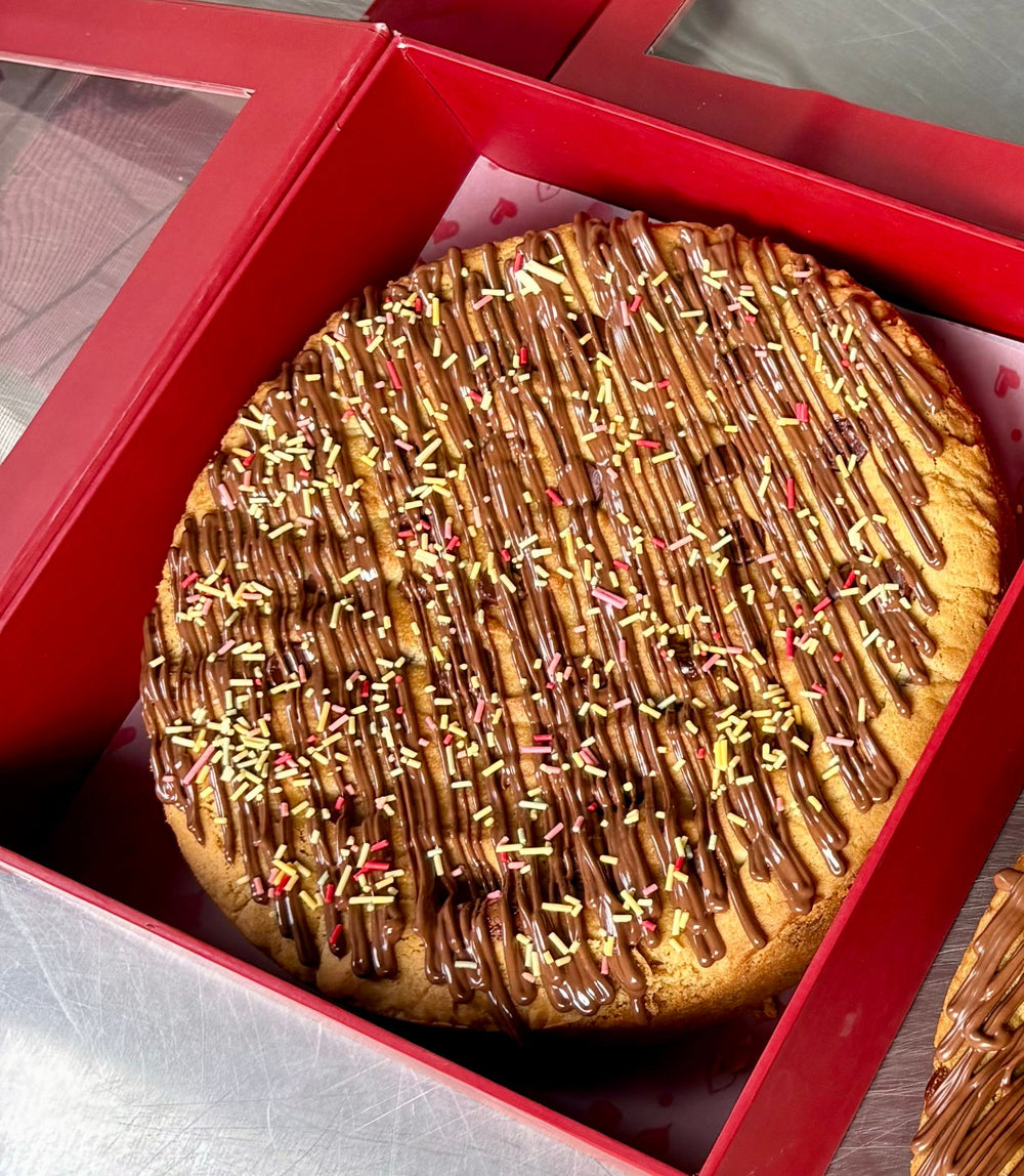 CHOCOLATE CHIP COOKIE PIZZA WITH NUTELLA DRIZZLE & SPRINKLES